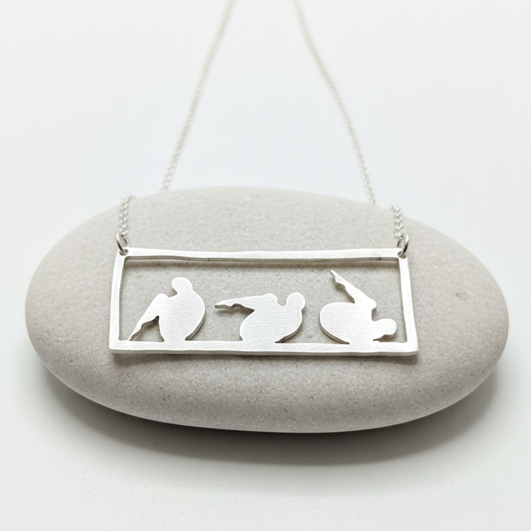 Sterling Silver Rolling like a ball pendant on a stone.